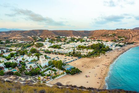 Agua Amarga, Spain - August 8, 2018. Sunset over the village Agua Amarga. As seen from the western hill.の写真素材