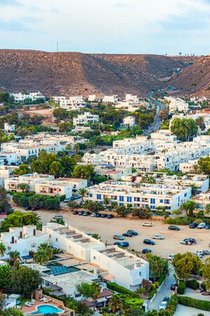 Agua Amarga, Spain - August 8, 2018. Sunset over the village Agua Amarga. As seen from the western hill.の写真素材