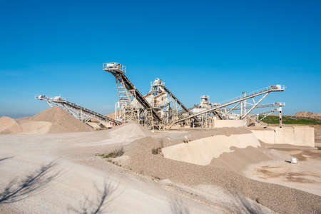 February 19, 2020 - Belianes-Preixana, Spain. A Gravel pit with heavy machinery on the edge of the SPA (Special protected area) Belianes-Preixana.のeditorial素材