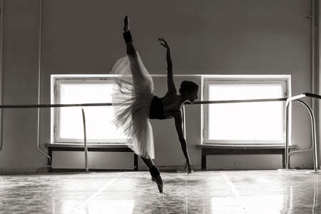 charming ballerina in a dance class shows elements of balletの写真素材