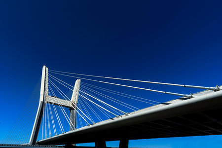 a cable-stayed bridge, suspension bridge against the sky, transport suspension bridge