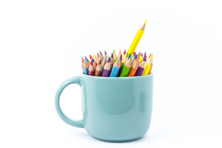 Color pencil in the cup on white backgroundの写真素材
