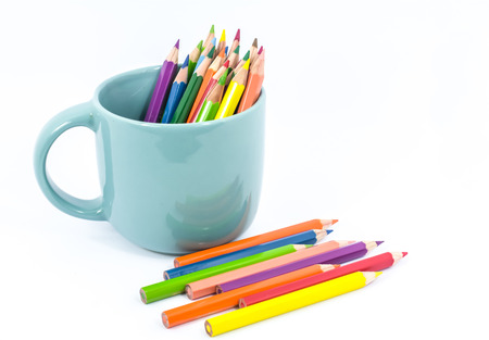 Color pencil in the cup on white backgroundの写真素材