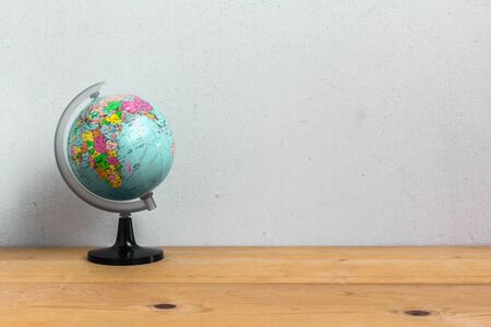 Globe on wood tableの写真素材