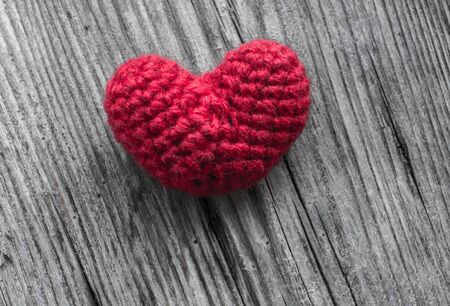 Red Heart Shaped Silk on Wood Backgroundの写真素材