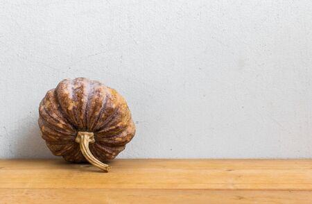 Small Pumpkin On Wood Tableの写真素材