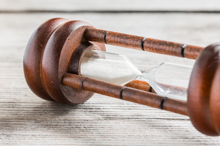 Close-up Hourglass on wood background