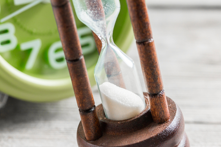 Close-up Hourglass on wood background