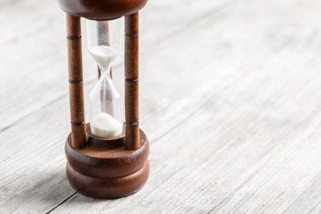 Close-up Hourglass on wood background
