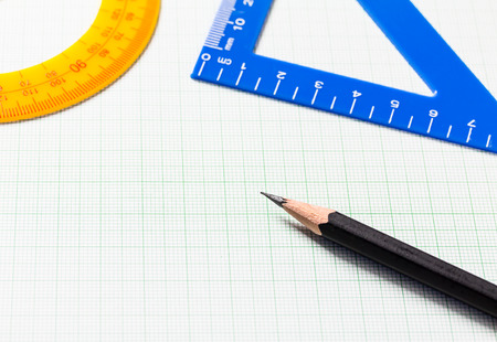 Pencil and Ruler on green graph paper with copy space , Selective focusの写真素材