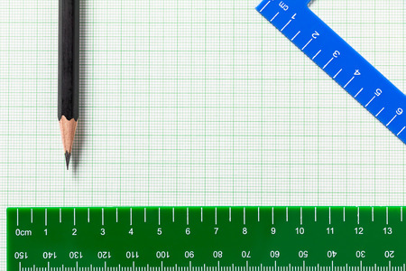 Pencil and Ruler on green graph paper with copy spaceの写真素材