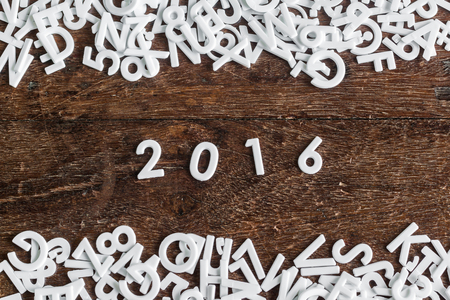 Letters 2016 and english alphabet background with space on wood texture , concept of new year 2016