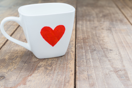 Cup of love  on wood tableの写真素材