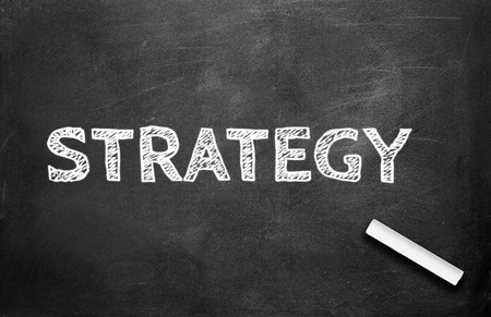 Chalk and strategy write on chalkboard backgroundの写真素材