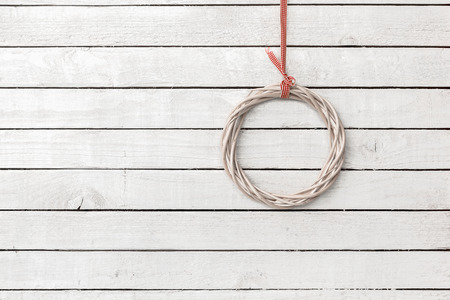 Circle Shaped made from wood weave hang over white wood backgroundの写真素材