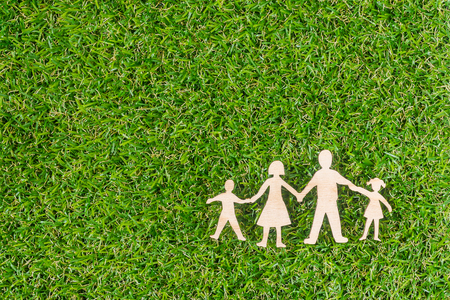Wood Family Shaped on green grass.  Green Family Concept.の写真素材