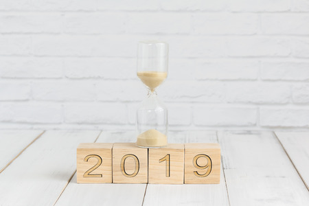 hour glass on 2019 new year block ,  time conceptの写真素材