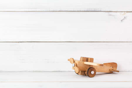 Wooden plane on white wood background, education concept.の写真素材