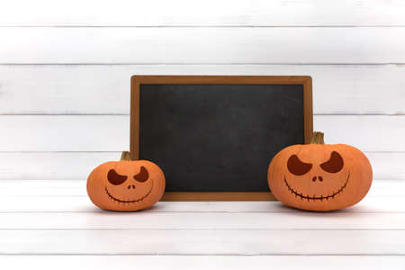 One spooky halloween pumpkin, Jack O Lantern, with an evil face and eyes and blackboard on a white wood background.の写真素材