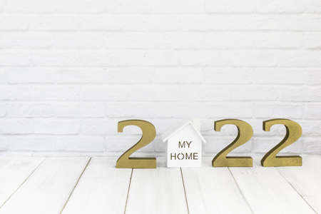 2022 new year and home  on white wood table over white background with copy space , Real estate...