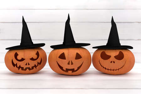Group spooky halloween pumpkin, Jack O Lantern, with an evil face and eyes and witch hat on a white wood background.の写真素材