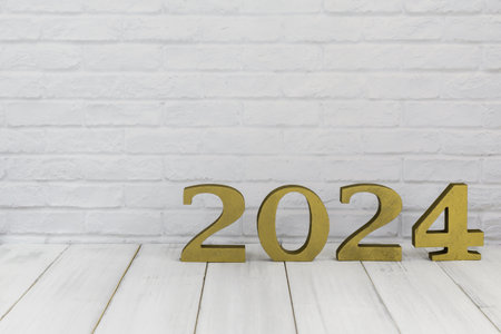 2024 new year on white wood table over white background with copy spaceの写真素材