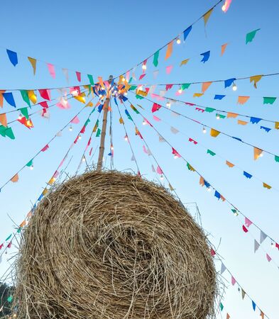 The rick and color flag are common decorations in countryside festivalの写真素材
