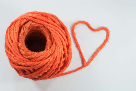 The lovely orange heart make from tail of knitting wool