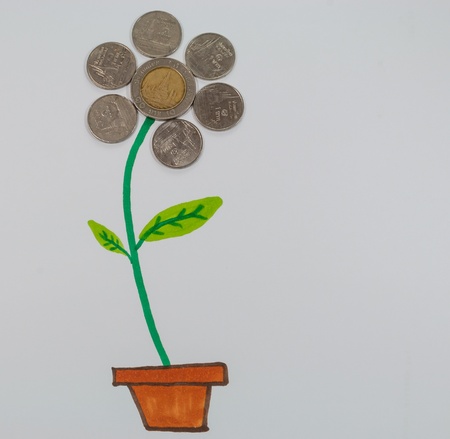The flower is composed of Thai coin and hand made paintingの写真素材