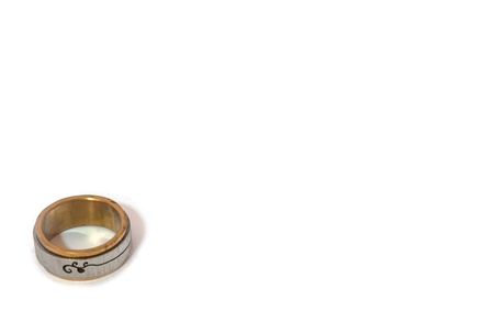 The isolated picture of one silver and golden ringの写真素材