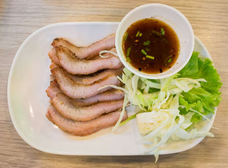 Slice pork steak with Thai style of sauceの写真素材
