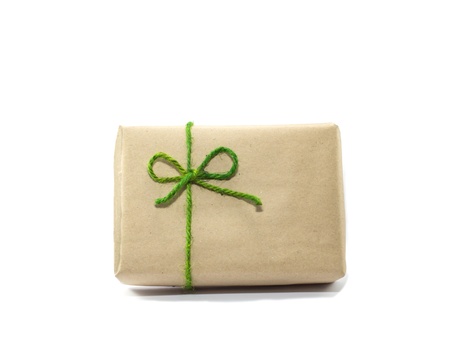 The gift box is wrap with recycle paper and green stringの写真素材