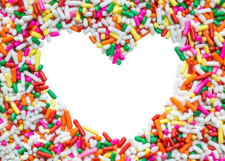 Colorful frame in heart shape, make of rainbow mix cake decors