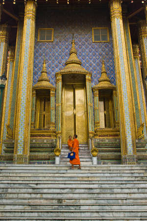 Golden door church and the monk at Wat Pra kaew Bangkok Thailandのeditorial素材