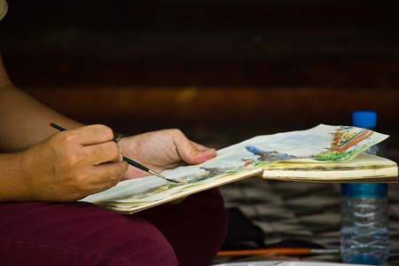 BANGKOK JULY 13: The hobby of artist with painting at Wat Pra Keaw on July 13, 2013 in Bangkok.のeditorial素材