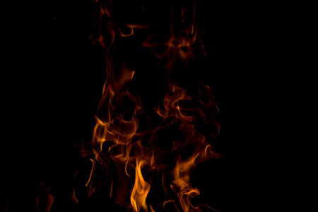 bright fire on a black background at night