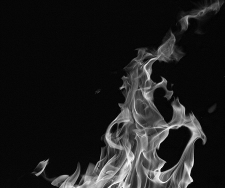 bright fire on a black background at night