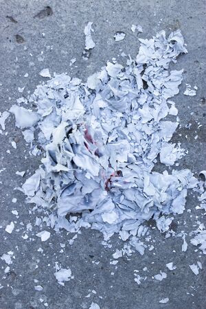 burning paper on the ground, polluted ecologyの写真素材