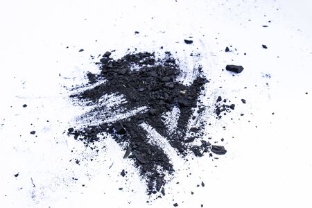 Black coal dust powder isolated on a white background