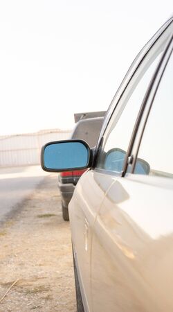 side mirror of a gray car side view, sun reflectionの写真素材