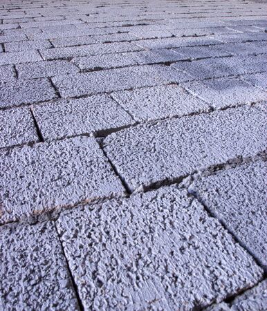 cinder block brick wall made of concrete as backgroundの写真素材