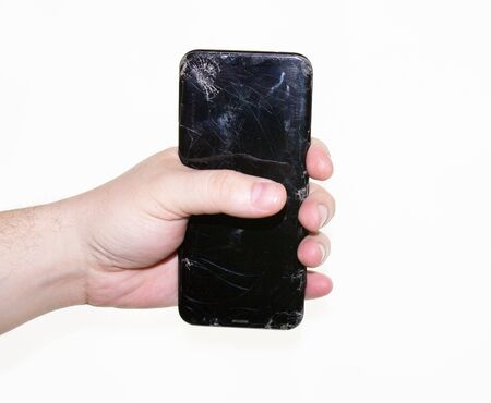 phone in hand on a white backgroundの写真素材