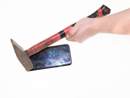 smashed the phone with a hammer on a white backgroundの写真素材