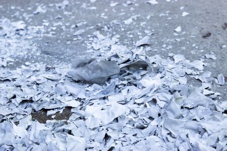 burning paper on the ground, polluted ecology