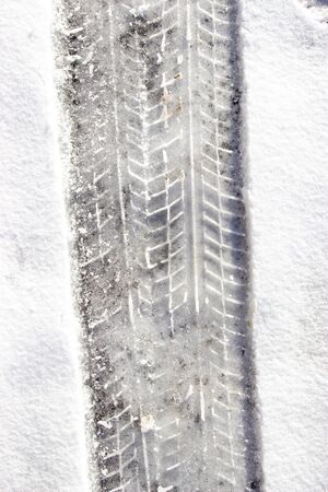 car tracks in the snowの写真素材