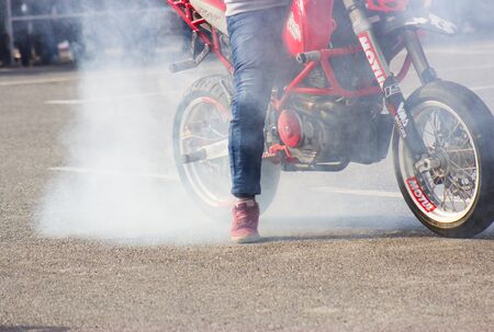 LVIV, UKRAINE - MAY, 2019: Athlete motorcycle racer rides and jumps on an enduro motorcycle on a motocross trackの写真素材