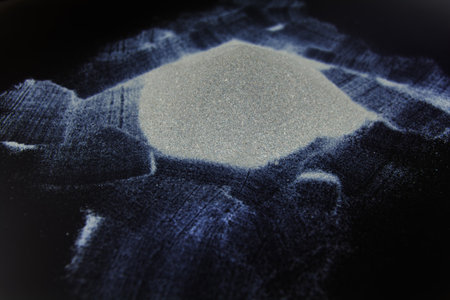 abstract white dust on a black background.の写真素材