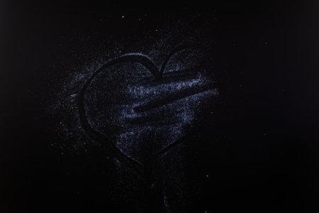 abstract white dust on a black background.の写真素材