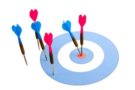 Blue and red darts on a blue and red dartboardの写真素材