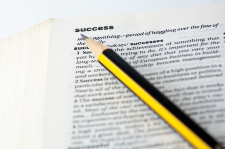Definition of success in a dictionary with a pencil on itの写真素材